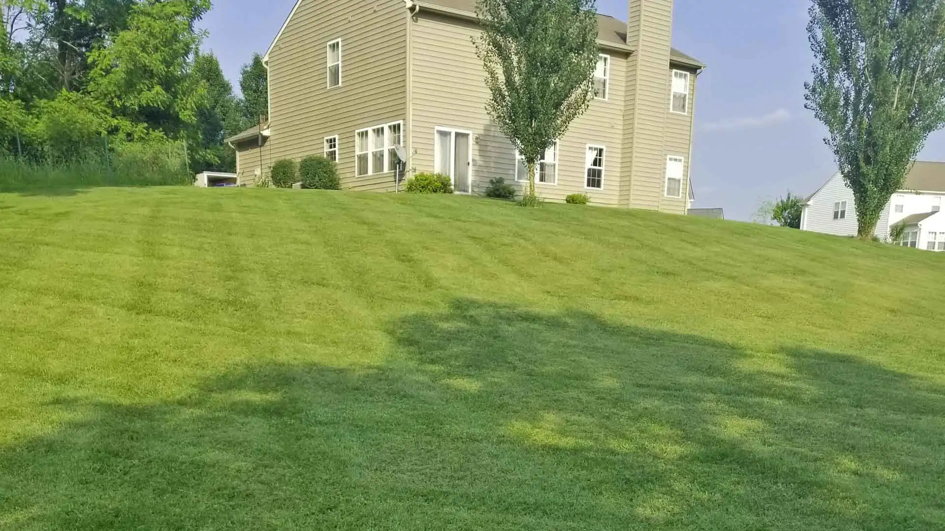Mowing a residential lawn in Carmel, IN.