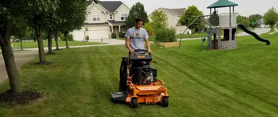 Stand-up mower cutting a lawn in Westfield, IN.