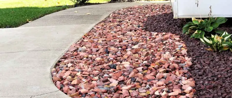 New rock installation by Spider Lawn & Landscape at a home in Carmel.