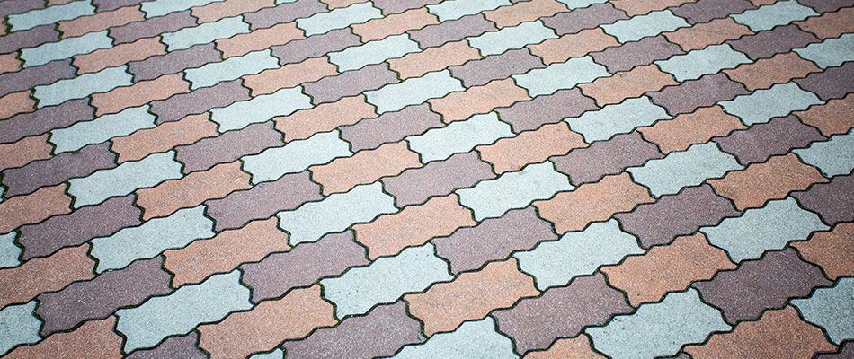 A custom decorative patio built with colorful pavers in Carmel, IN. 