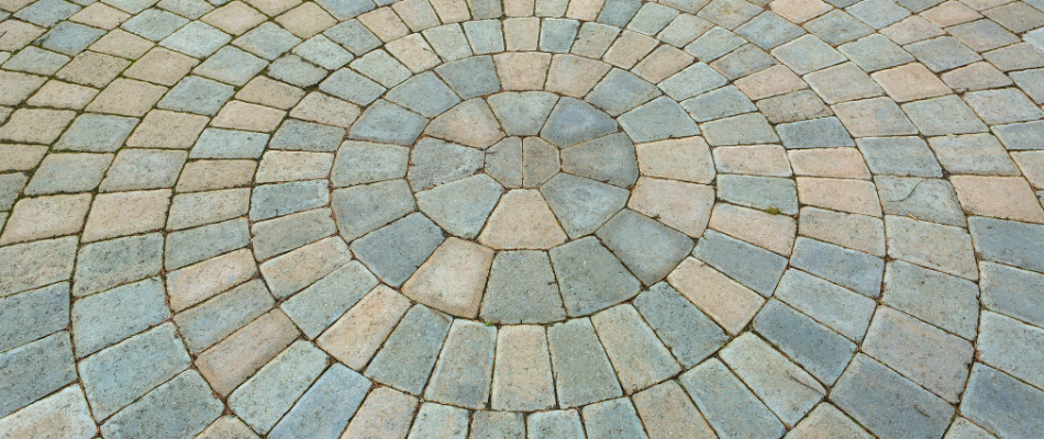 A custom paver driveway with a round pattern installed by our team in Westfield, IN. 